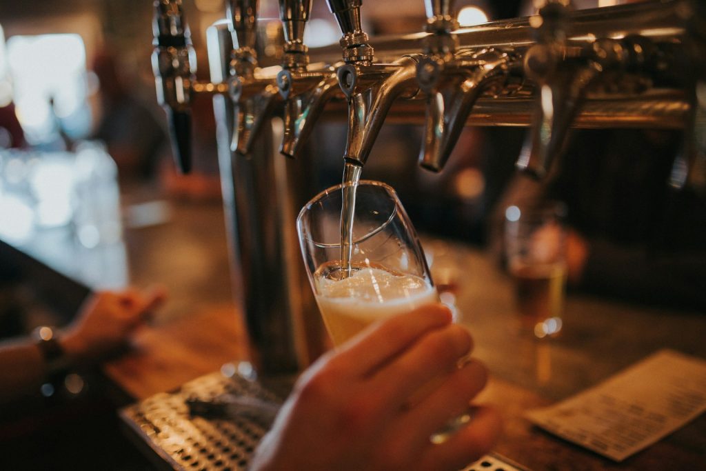 Home 4 person filling beer on glass