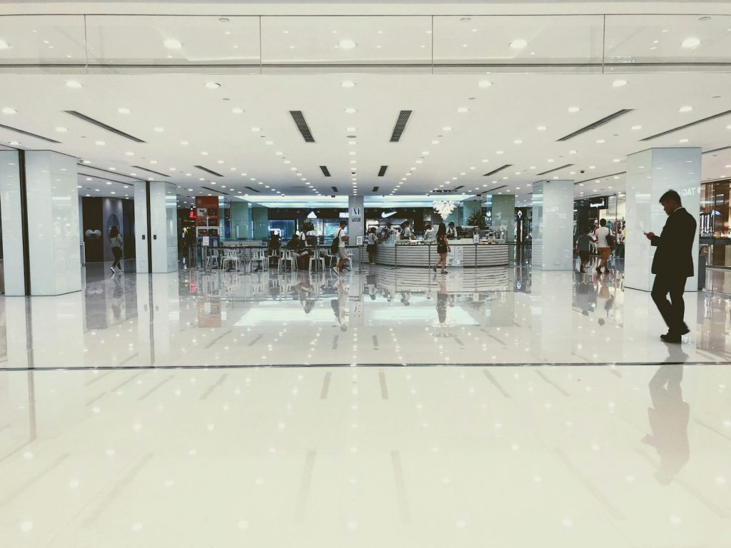 Home 1 man walking in mall